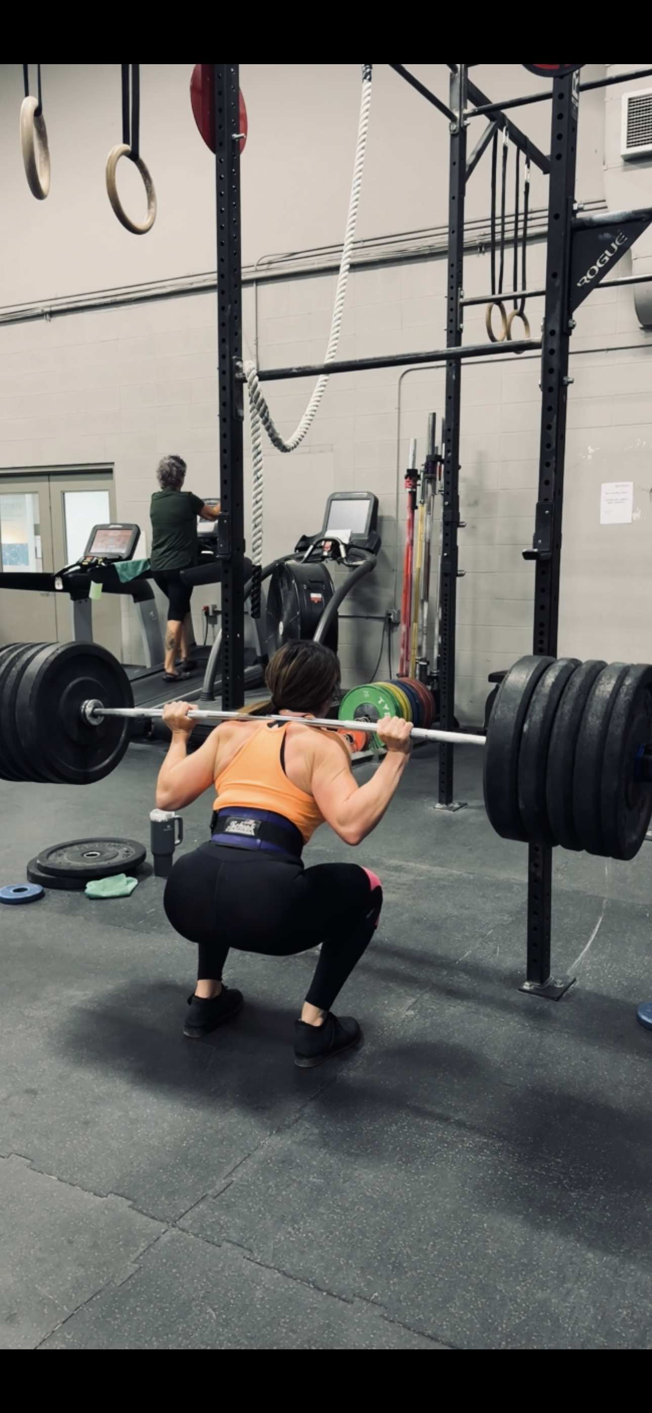 Woman performing a barbell squat